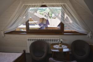 Posedenie v ubytovaní DW Basia pokoje i apartament