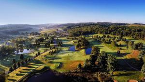 an overhead view of a golf course with trees and water at Byrncliff Golf Resort in Varysburg
