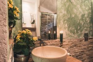a bathroom with a bath tub and a mirror at Borgo degli Ulivi in Porto Ercole +37 photos