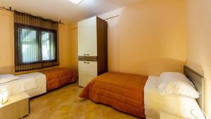 A bed or beds in a room at Residence Hydria