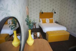 a model of a bedroom with a bed and a couch at Embankment Hotel in Bedford +64 photos