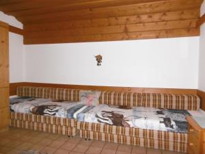 Postel nebo postele na pokoji v ubytování Ferienhaus Anderles-Alm