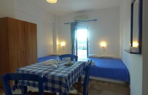 Postel nebo postele na pokoji v ubytování Helios Studios & Apartments