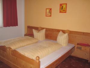 Ein Bett oder Betten in einem Zimmer der Unterkunft Apartmenthaus Rupitsch