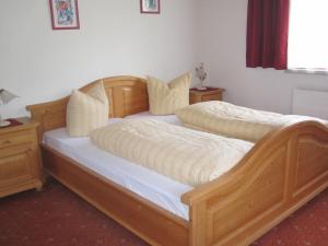 Ein Bett oder Betten in einem Zimmer der Unterkunft Apartmenthaus Rupitsch