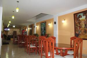 a dining room with wooden tables and chairs at Retamas Hotel in Cajamarca