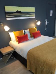 En eller flere senge i et værelse på Hotel Ar Terra Nova