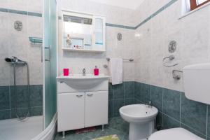 a bathroom with a sink and a toilet and a shower at Oasis of Peace and Relaxation near Opatija in Matulji +38 photos