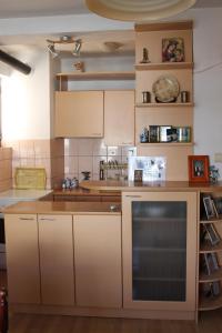 a kitchen with white cabinets and a counter top at Guest House Ohrid Trpeski in Ohrid