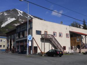 a black car parked in front of a building at A Swan Nest Inn in Seward