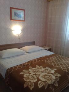 Postel nebo postele na pokoji v ubytování Guesthouse Mimas