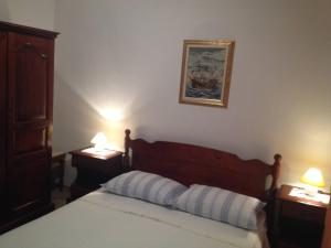 Postel nebo postele na pokoji v ubytování Guesthouse Mimas