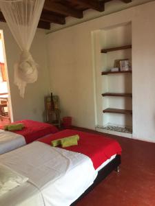 Postel nebo postele na pokoji v ubytování Finca San Rafael - Cafe y Cacao