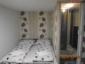 A bed or beds in a room at Micófogadó
