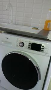a washing machine with a sink on top of it at Nice Apart backpackers S5 in Nice