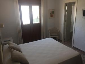 Postel nebo postele na pokoji v ubytování Hotel Almadraba