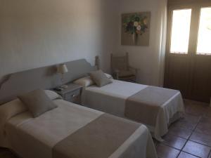 Postel nebo postele na pokoji v ubytování Hotel Almadraba