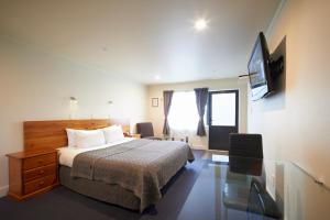 TV a/nebo společenská místnost v ubytování Auto Lodge Motel