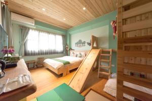 Postel nebo postele na pokoji v ubytování Shang Shui Yun Ji B&B