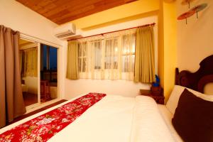 Letto o letti in una camera di Tang Chao B&B