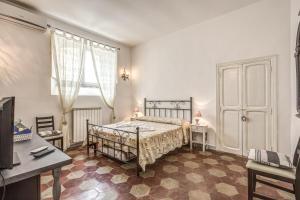 מיטה או מיטות בחדר ב-Relais La Torretta