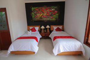 Een bed of bedden in een kamer bij Bubu Inn
