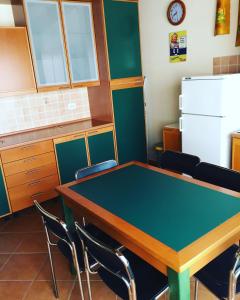 a conference room with a table and chairs at La casa di nonna Rosa in Isola delle Femmine