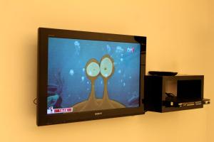 TV a/nebo společenská místnost v ubytování Time Hotel