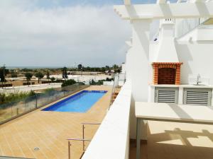 a view from the balcony of a house with a swimming pool at Pérola do Oceano in Manta Rota