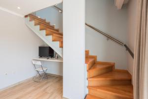 a staircase in a house with a desk at Pansion Ermioni in Skala