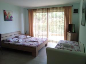 Postel nebo postele na pokoji v ubytování Apartments M&Z