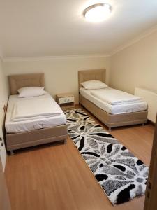 Postel nebo postele na pokoji v ubytování Uzungol Apart