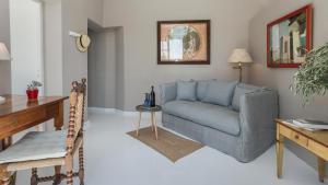 a living room with a couch and a table at Finca Son Miranda in Sencelles