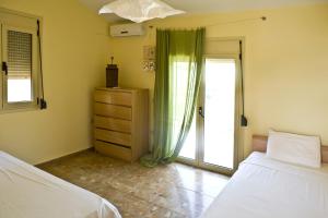 Postel nebo postele na pokoji v ubytování Villa Starshell A'