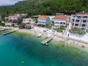 an aerial view of a beach with buildings and the water at Villa Orca in Podaca