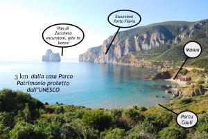 a view of a beach and a mountain at Il Dolce Risveglio Tanca Piras in Nebida +78 photos