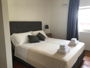 A bed or beds in a room at Corte di Pellio