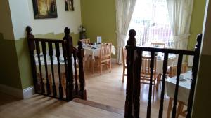 a staircase leading to a dining room with a table at Abacus Guesthouse in Galway