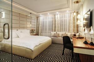 En eller flere senge i et værelse på Apartamenty Chleb i Wino