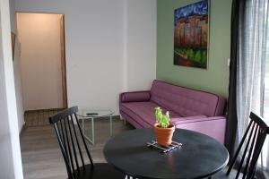 Posezení v ubytování Aphelion Holiday Apartments