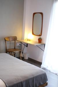 Postel nebo postele na pokoji v ubytování Aphelion Holiday Apartments