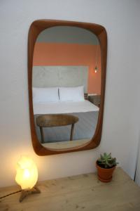 Postel nebo postele na pokoji v ubytování Aphelion Holiday Apartments