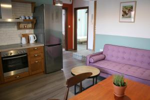 Kuchyň nebo kuchyňský kout v ubytování Aphelion Holiday Apartments
