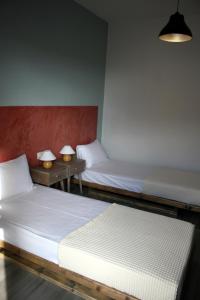 Postel nebo postele na pokoji v ubytování Aphelion Holiday Apartments