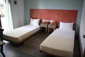 Postel nebo postele na pokoji v ubytování Aphelion Holiday Apartments