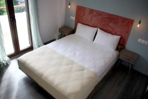 Postel nebo postele na pokoji v ubytování Aphelion Holiday Apartments