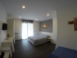 Postel nebo postele na pokoji v ubytování B&B Villa del Lago