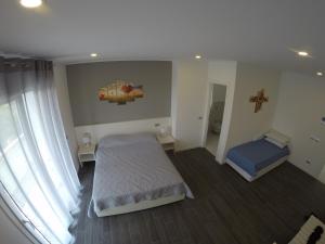 Postel nebo postele na pokoji v ubytování B&B Villa del Lago