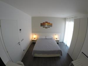 Postel nebo postele na pokoji v ubytování B&B Villa del Lago