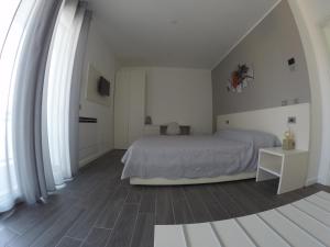 Postel nebo postele na pokoji v ubytování B&B Villa del Lago